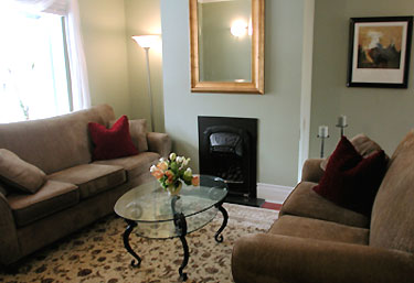 Living room after it is staged with rental furniture by Six Elements.
